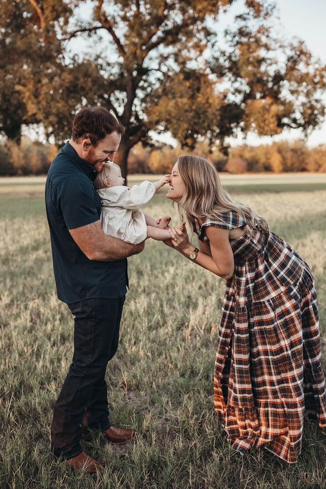 Family photography session at Flower Mound park with kids playing and laughing